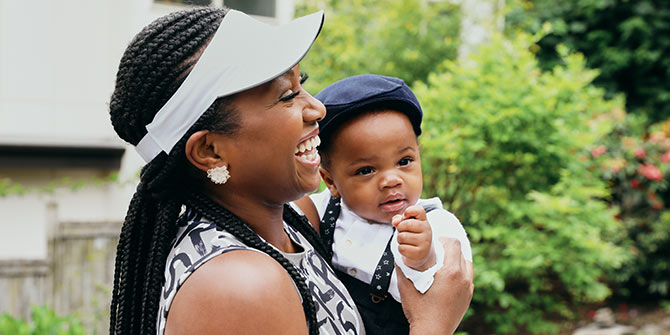 Olu holding her child