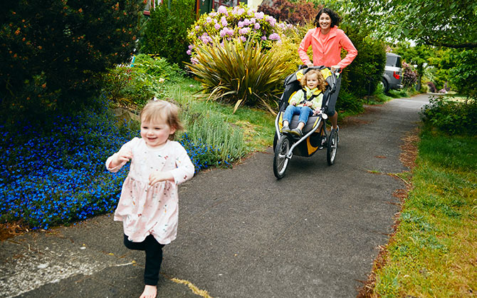 Amber running with her stroller and her other little one running in front of her