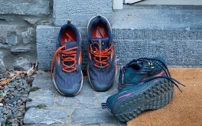 Running shoes propped up against a step