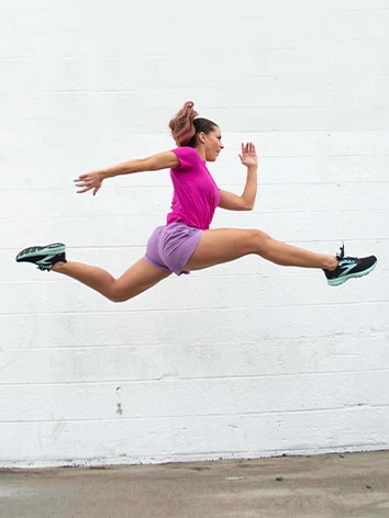 Woman jumping into the splits