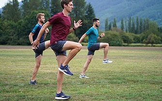 Runners warming up in a field