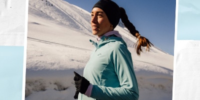 Une femme qui court dehors dans la neige