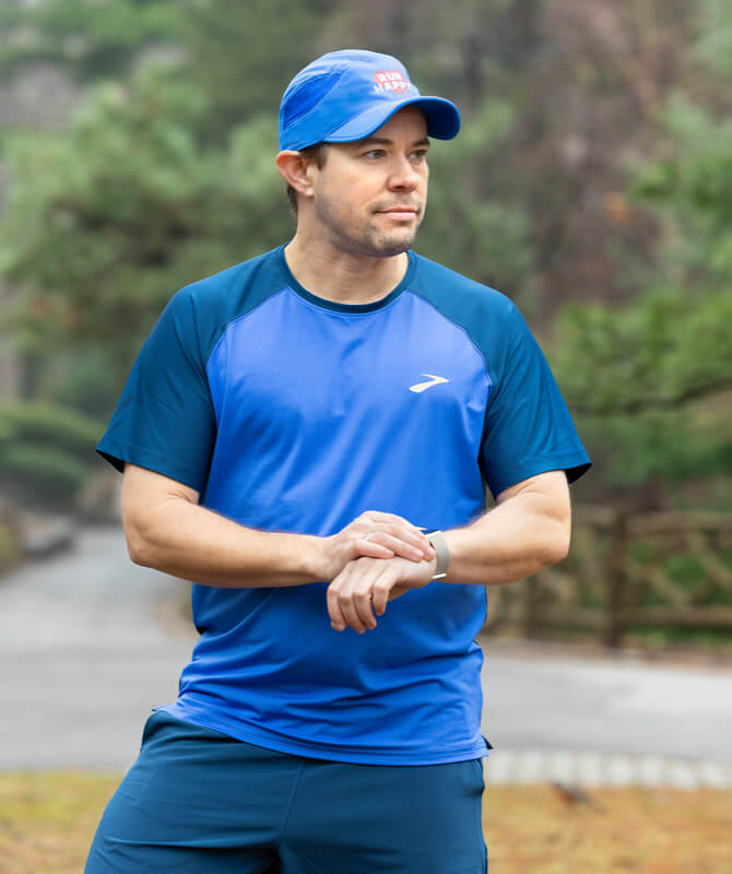 AJ looking to the side in blue Brooks gear