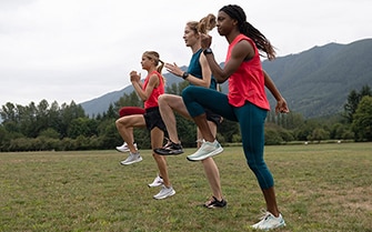 Athletes warming up in a field