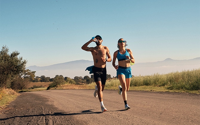 A woman and a man running