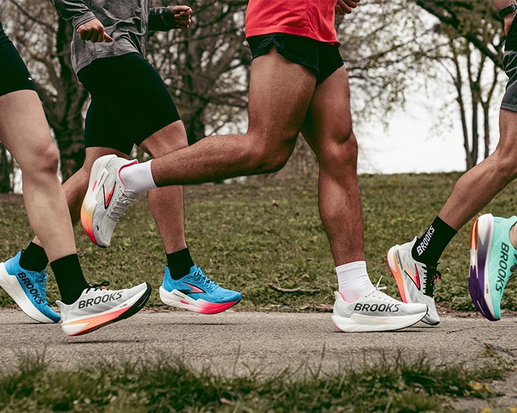 Close up shot of a group of people running in the park