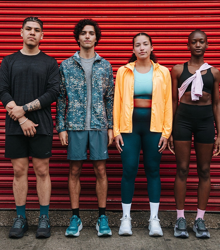 Medium shot of a group of models posing in front of a camera