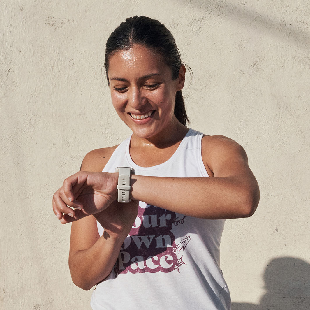 Runner adjusting their watch